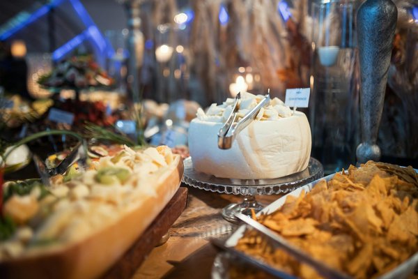 How can you design a kitchen to seamlessly integrate outdoor cooking spaces?