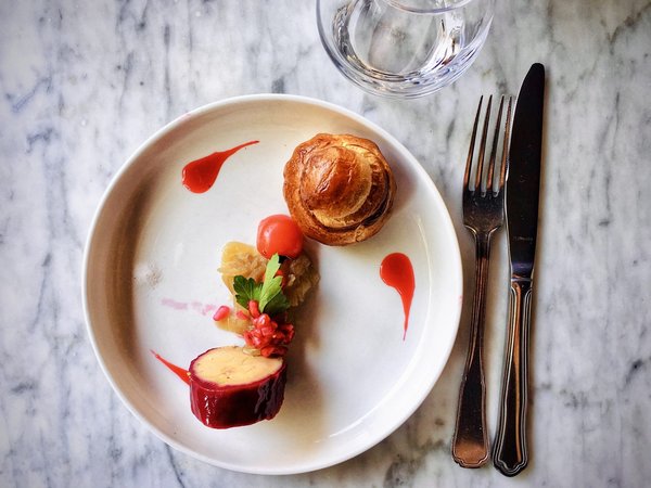 How can the installation of an adjustable track lighting system in the kitchen influence meal presentation and portion size?